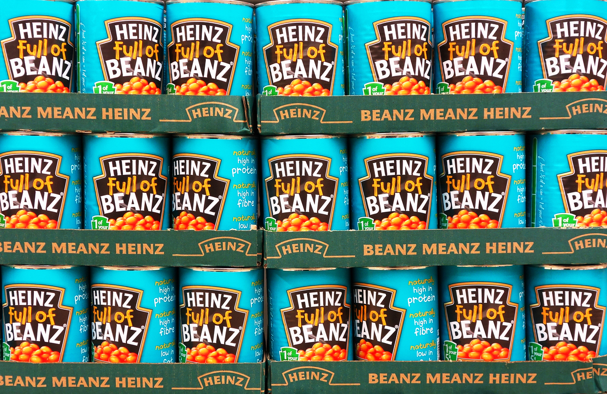 A store displays shelves of Heinz beans.