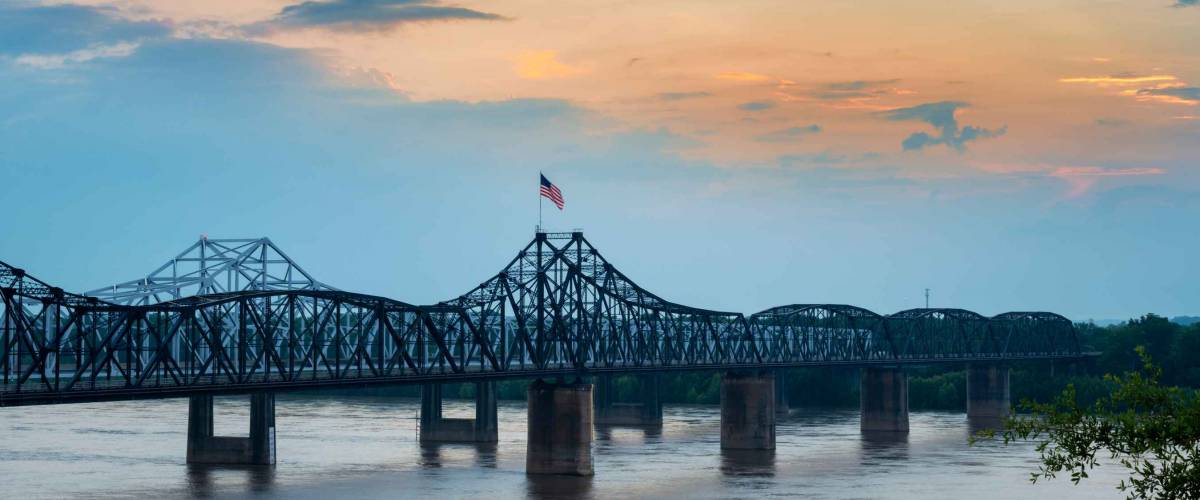 View of the Vicksburg bridge over the Mississippi River at sunset