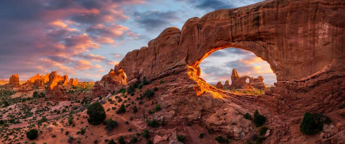 Evening light over North Window with Turret Arch in the distance, Arches National Park Utah